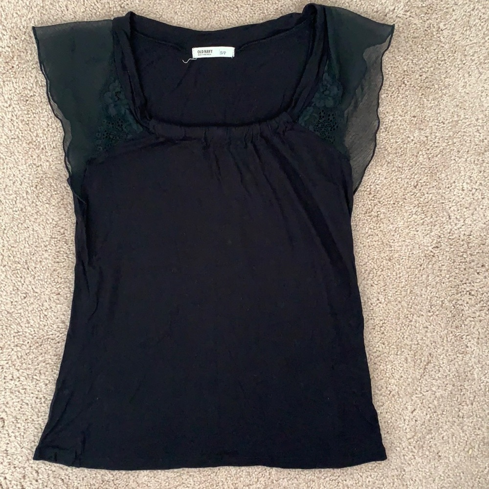 Small black short sleeve shirt with ruffle details on the sleeves